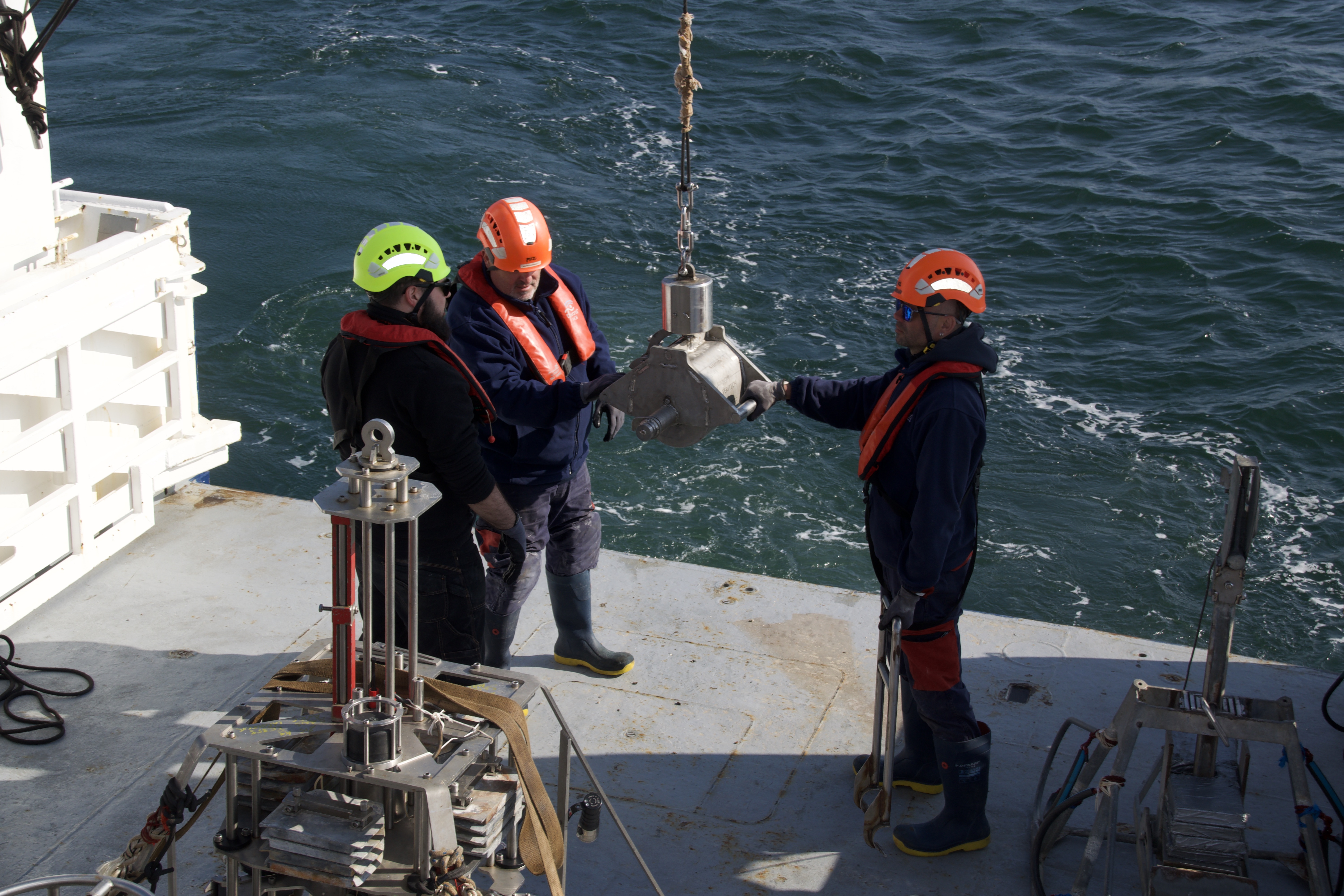 Crew preparing the Shipek scooping device